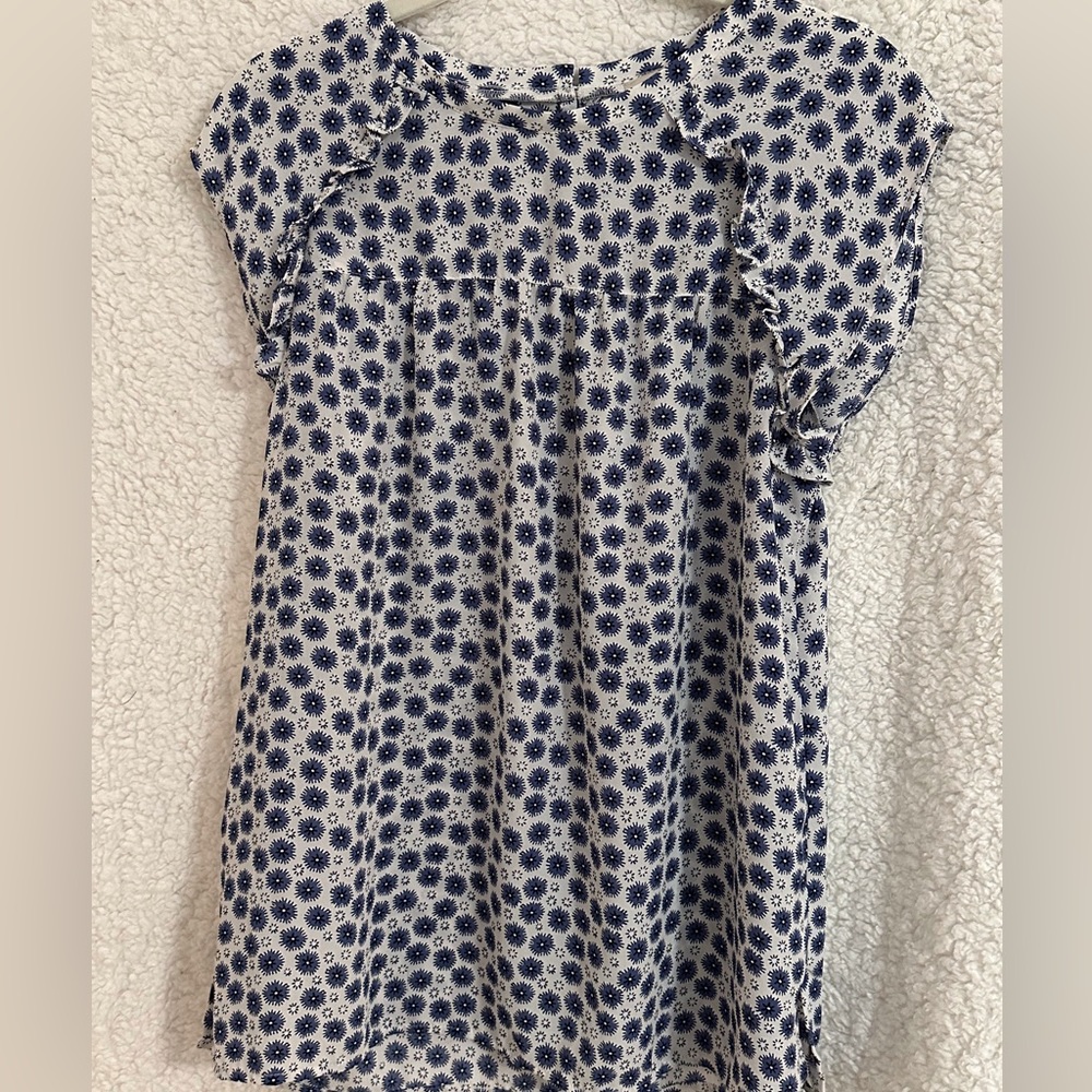 Loft outlet short sleeve top with ruffle detail at shoulders.